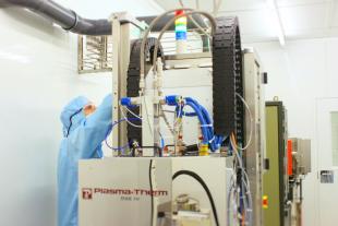 Researcher working with Wafer Fabrication Equipment at the SMC